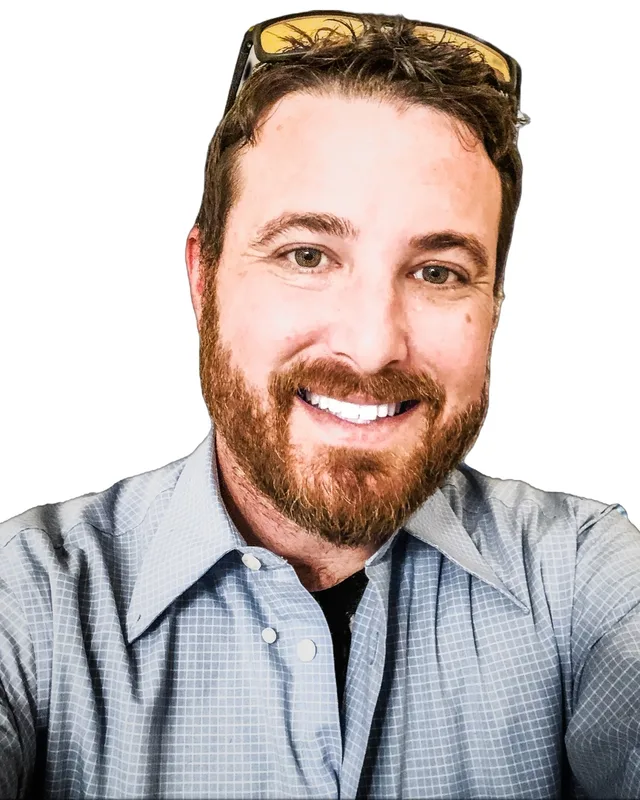 Matt Clark, smiling, sunglasses pushed up on his head
